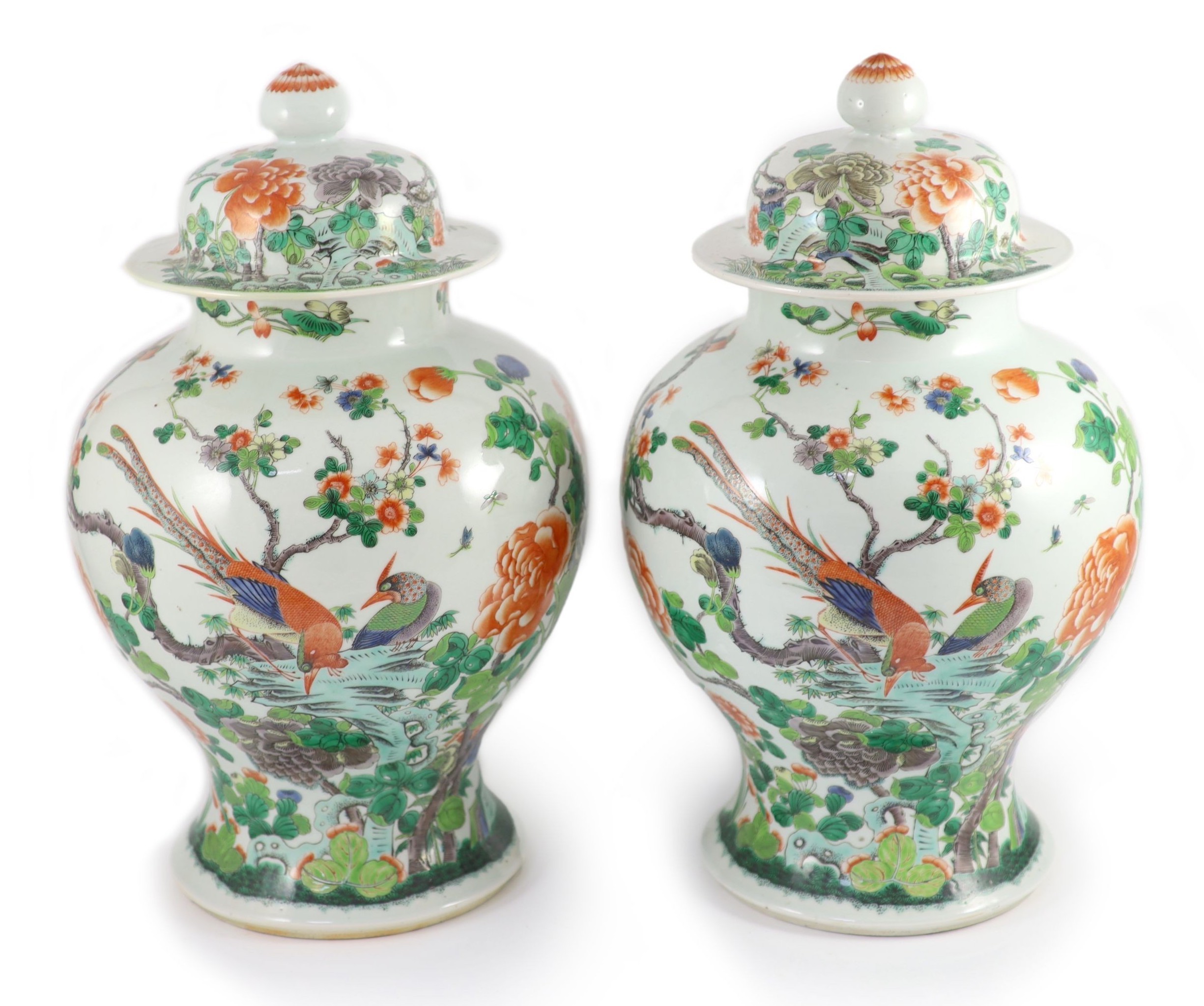 A pair of large Chinese famille verte jars and covers, late 19th century, 45cm high, restorations